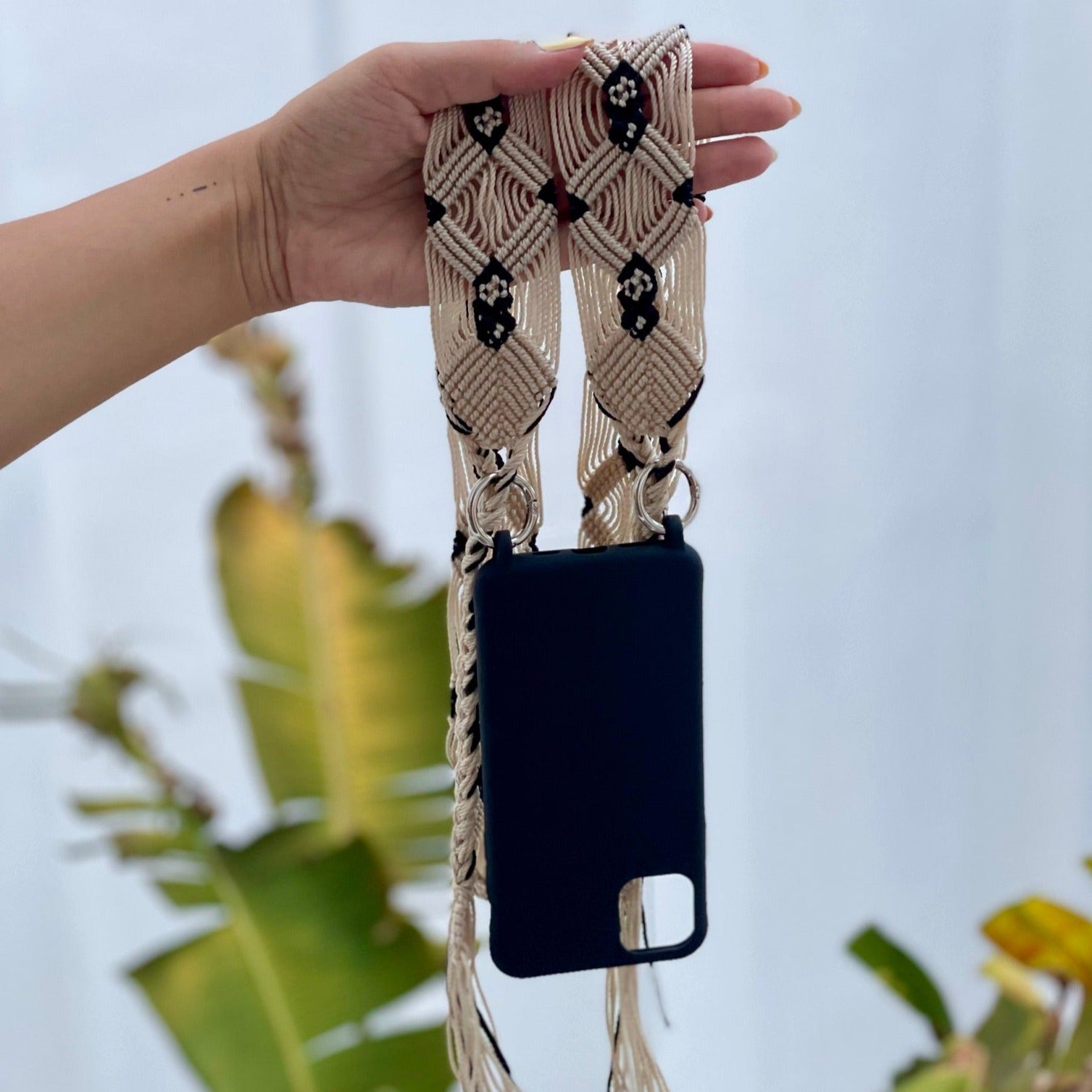beige phone and bag strap