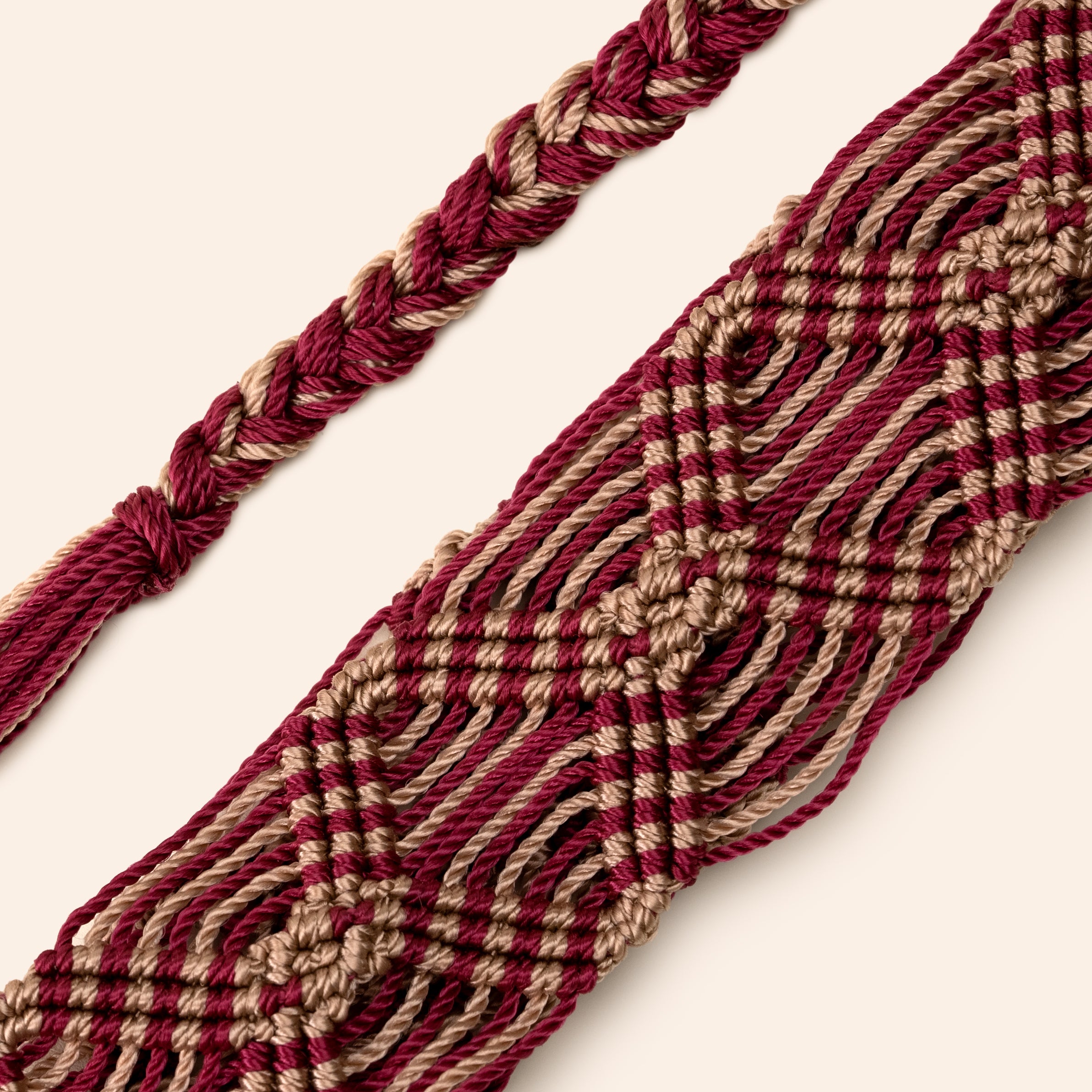 red and beige phone and bag strap