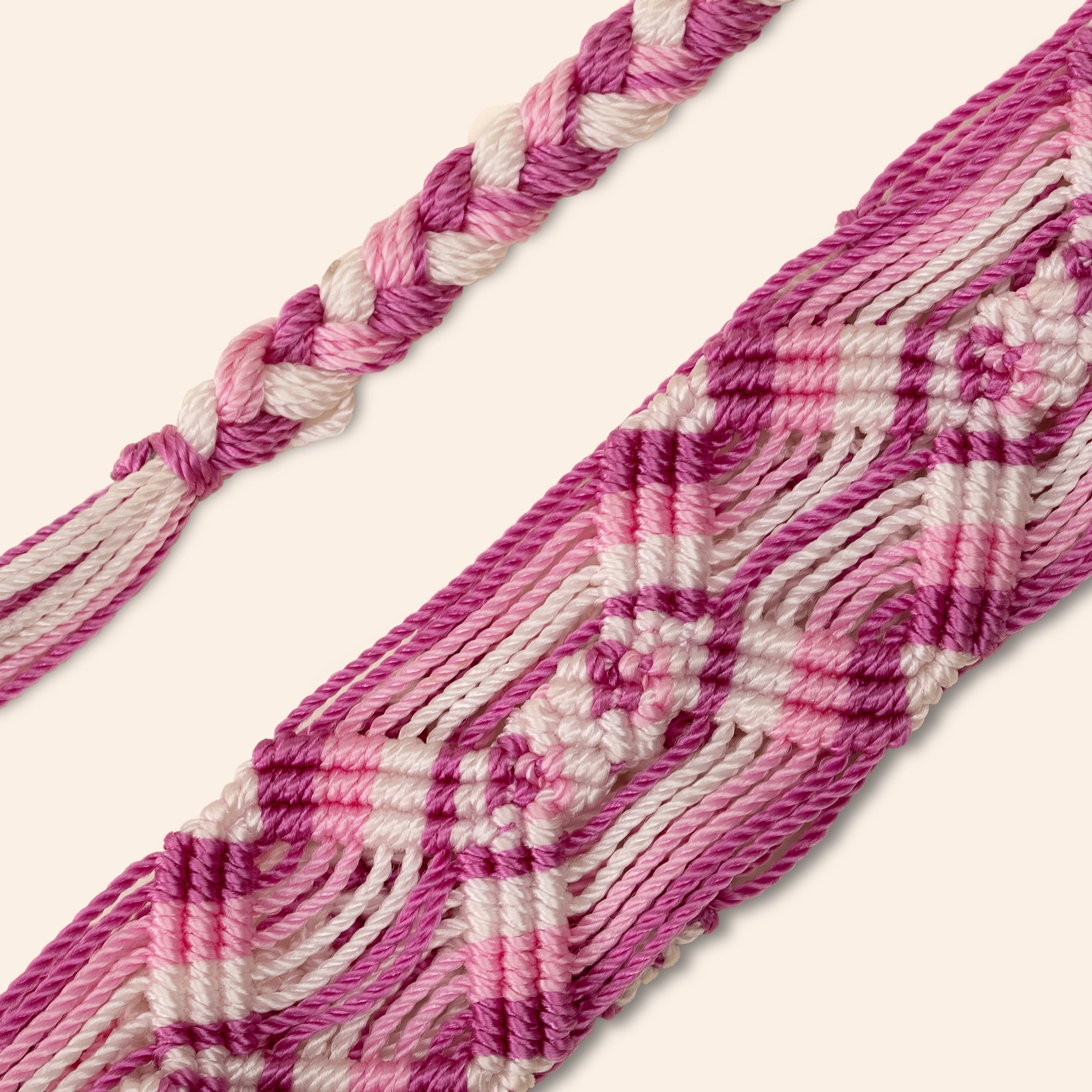 pink and white phone and bag strap
